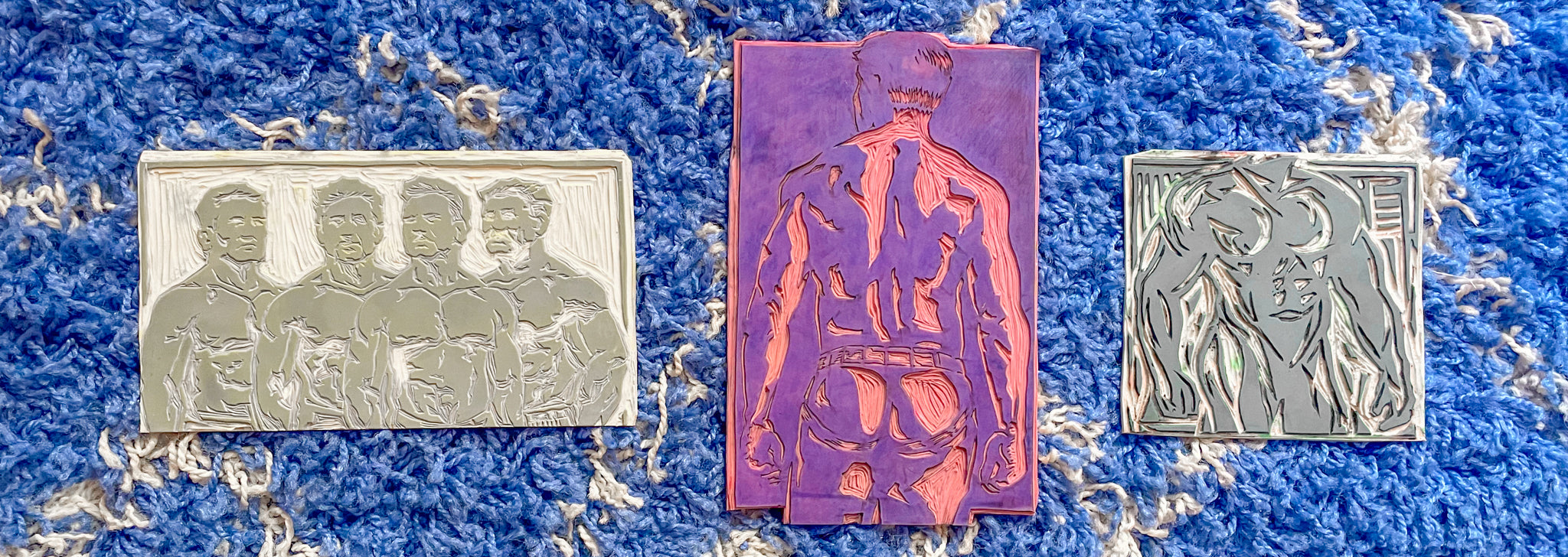 Three Linoleum block carvings of men 