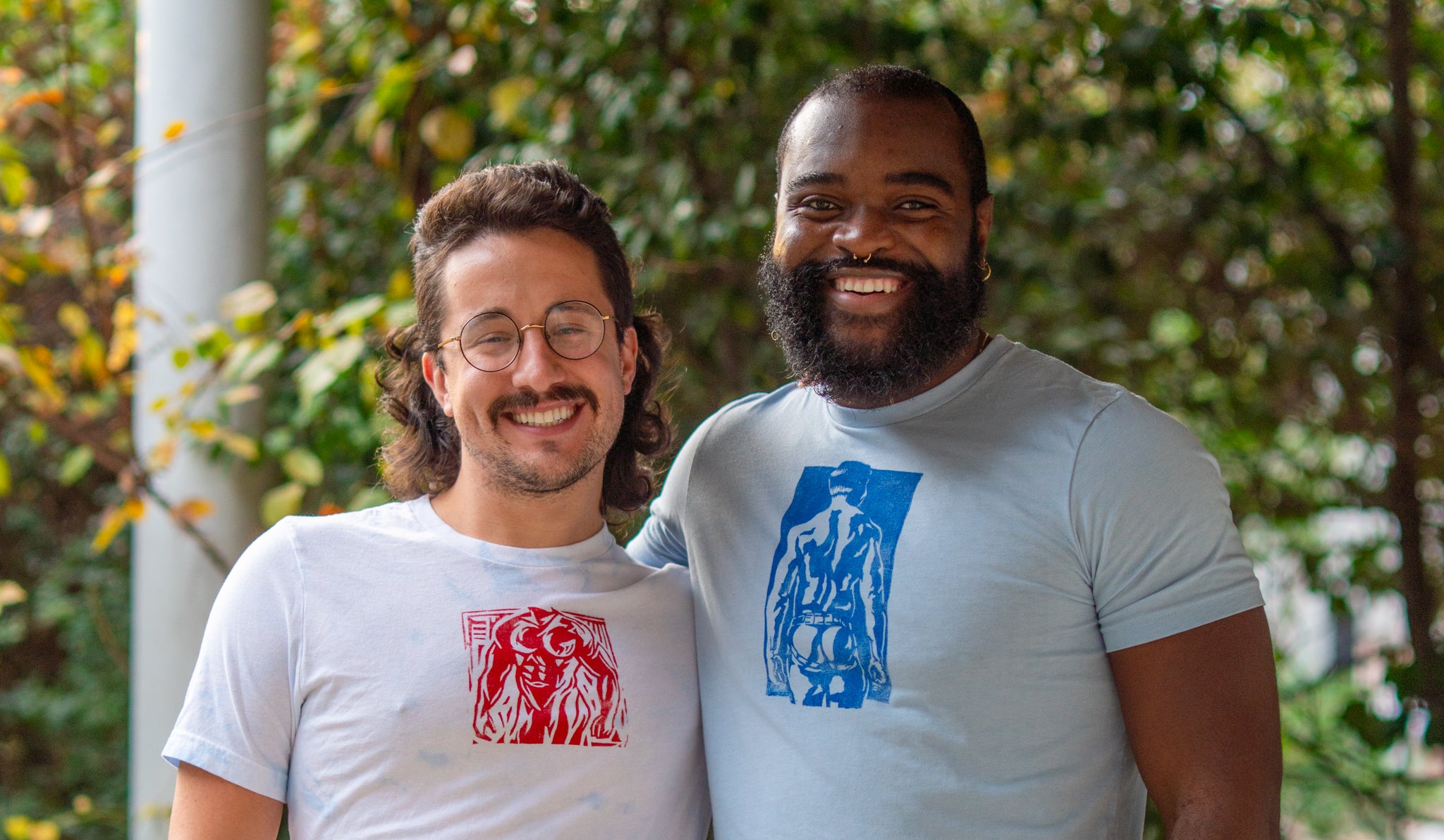 Two Men Wearing T-shirts with Hand Printed Designs